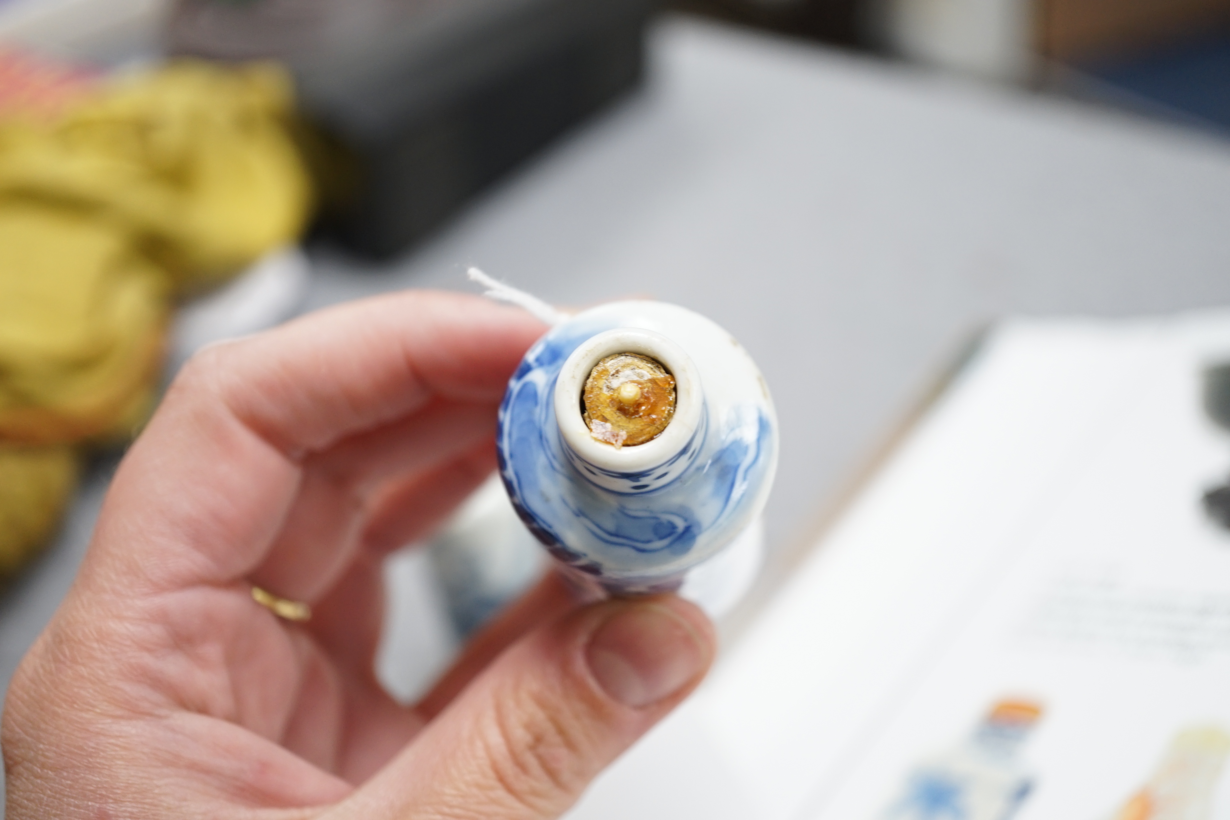 A Chinese iron red enamelled ‘dragon’ snuff bottle, Tongzhi mark and of the period (1862-74), together with two Chinese blue and white cylindrical snuff bottles, 19th century